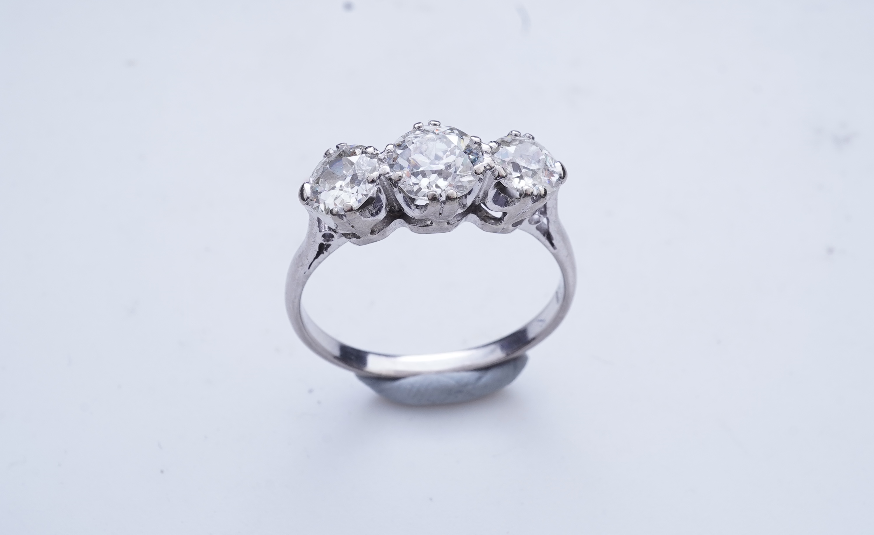A three-stone diamond ring, early 20th century